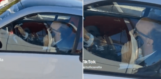 Al volante senza cintura e al telefono, bufera social su Roberto Benigni