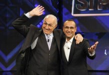 Baudo, Conti ricorda il grande conduttore: “Lui è la tv, indimenticabili i suoi abbracci paterni”