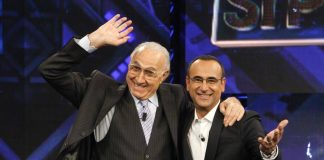 Baudo, Conti ricorda il grande conduttore: “Lui è la tv, indimenticabili i suoi abbracci paterni”